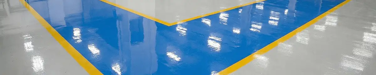 A factory floor professionally covered and marked with epoxy flooring in Sarasota, FL