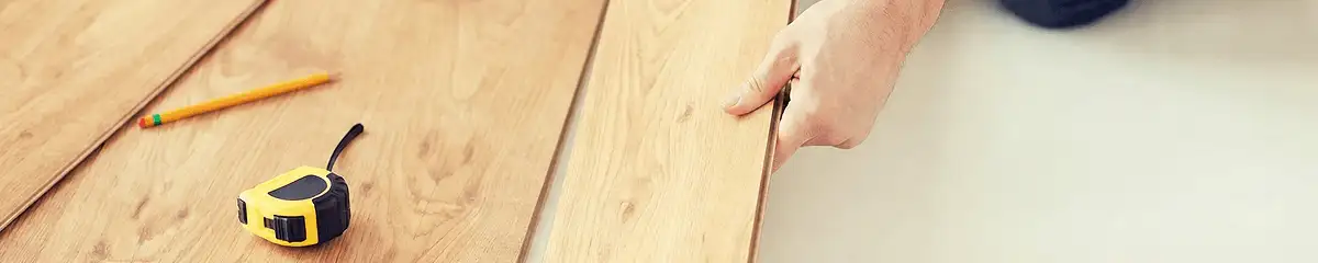 A professional installing wood flooring in Sarasota, FL