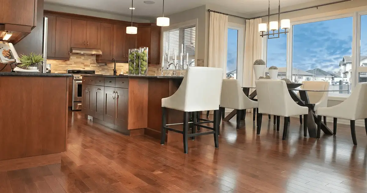 A modern kitchen with professionally installed wood flooring in Sarasota, FL