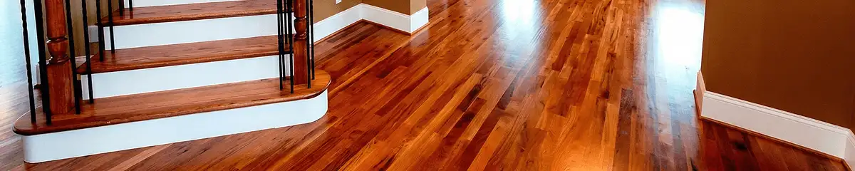 Base floor of a staircase with professionally restored wood flooring in Sarasota FL