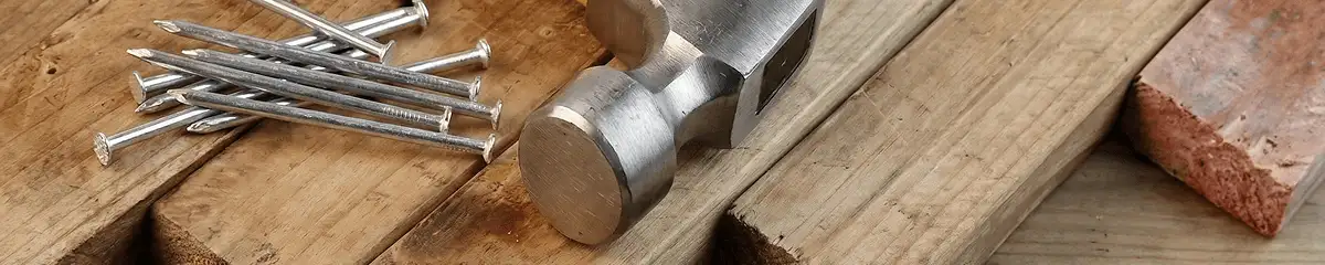 Hammer and nails on hardwood flooring boards in Sarasota, FL