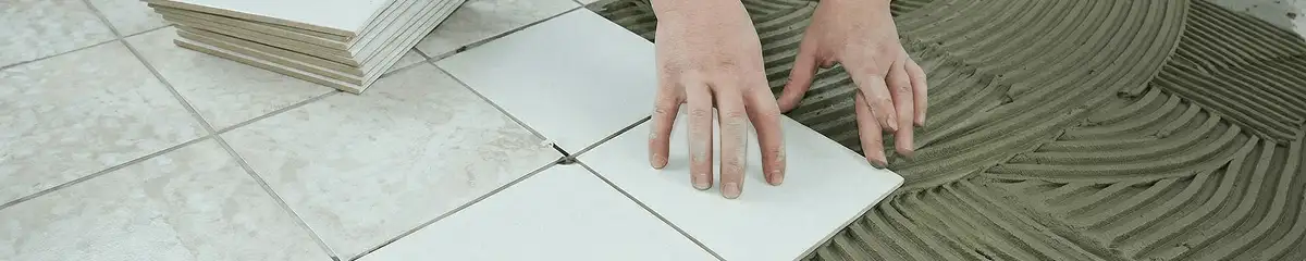 Professional installing white tile floors in Sarasota, FL