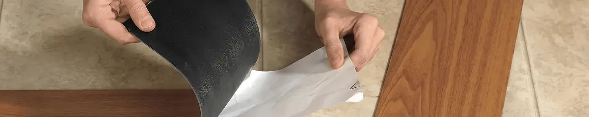 A professional installing vinyl flooring in Sarasota, FL