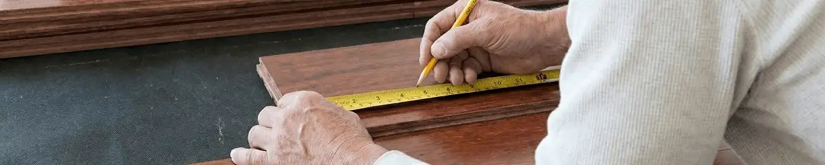 A professional installing wood flooring in Sarasota, FL